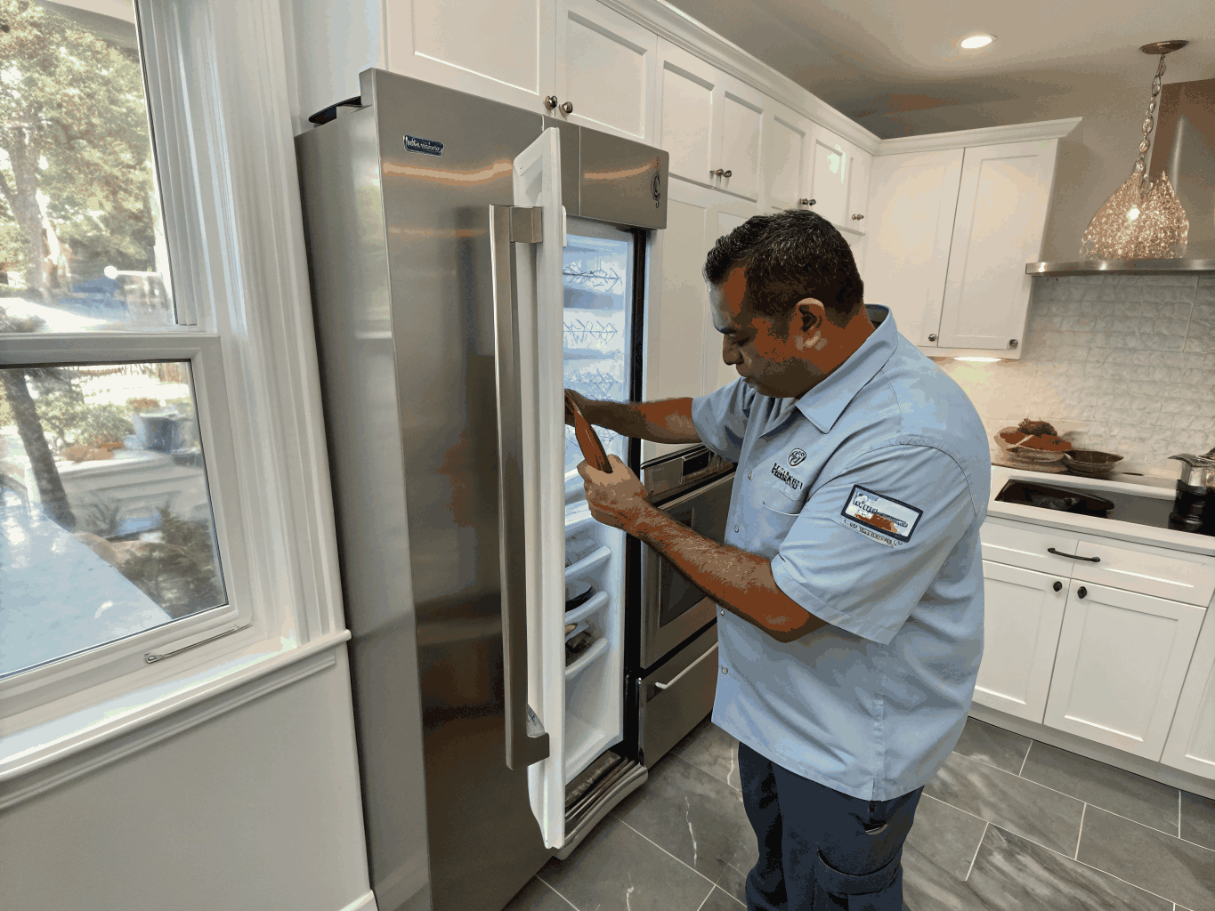 Ice maker repair technician replacing water valve